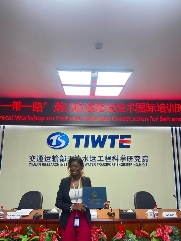 Clara Fatu Kenfack receiving her certificate of participation from TIWTE